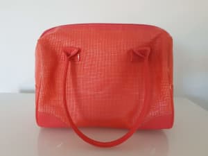 Natio orange hand bag or cosmetic bag