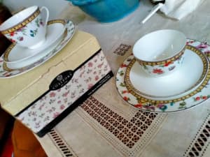 Coalport tea cups, saucers and plates