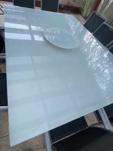 Outdoor glass table.
