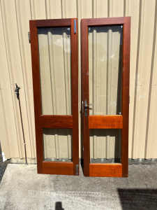 Three Red Cedar French doors, incl. frames.