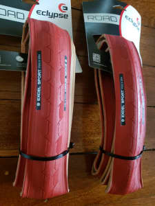 Red bicycle tyres for road / fixed gear bike