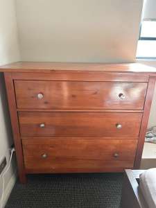 Brown chest of draws and brown bed side table