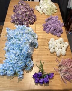 Artificial flowers. $0.50c each. Assorted colours & quantity.