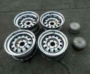 Set of four HQ pattern 15 inch 12 slot wheels with centre caps