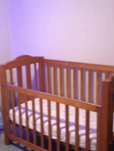 Wooden cot, mattress and change table