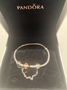 Pandora bracelet with gold clasp & safety chain