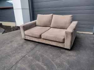 2 seater light coloured lounge 