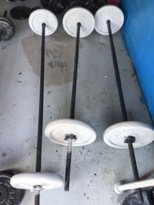 Three sets off weights with long bars very good condition 2x10kg