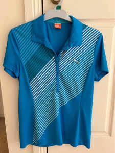 Womens Puma Blue golf shirt. Used. Size M (US 10-12)