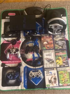 Ps2 with 7 games 4 controllers and a steering wheel
