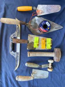 bricklaying tools - all undamaged, many bricks left in these tools