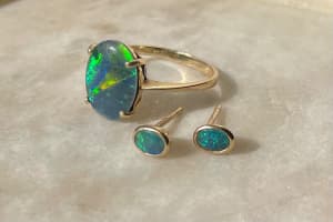 9 caret gold, delicate opal ring & stud earrings