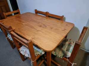 Six seater solid pine dining table and chairs