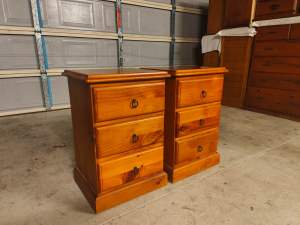 Pair of matching solid timber bedside tables metal runners