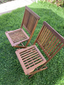 Hardwood outdoor table and folding chairs