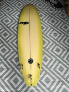 MG 6’10 mid length surfboard includes fins