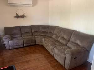 Brown six seater couch with two recliners