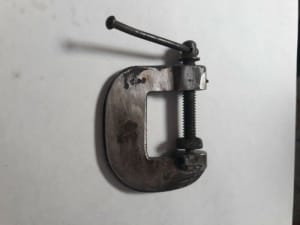 Small thumb size G clamp.