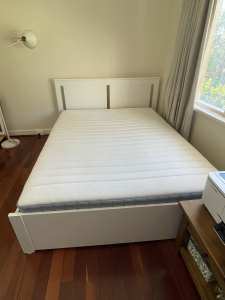 Still available White IKEA queen bed with drawers and Valevag mattress
