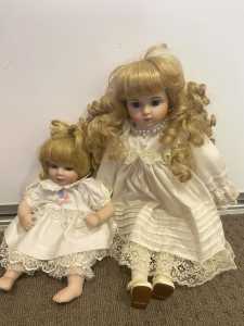Porcelain doll and baby