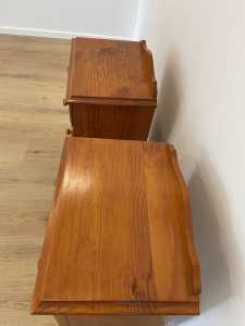 A pair of bedside tables
