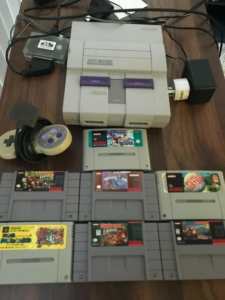 SNES Super Nintendo NTSC USA version with 7 games 3 controllers