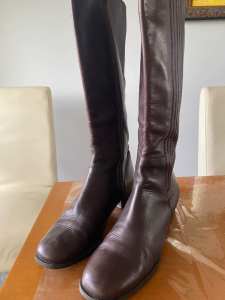 Long leather knee length boots.