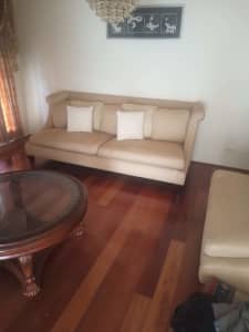 Two Beige Couch with Pillows and Round Table Included