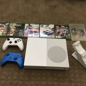 X-Box 1S (1TB), two controllers, wireless charger & 6 games.