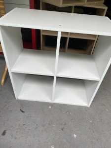 Three storage cubes, one white and two wood finish