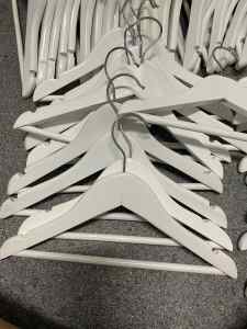 Children’s white wooden coat hangers (70 pieces)