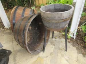 Half wine barrel on metal stand