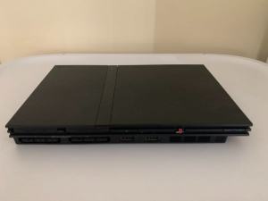 PlayStation 2 Slim with controller, memory card and games.