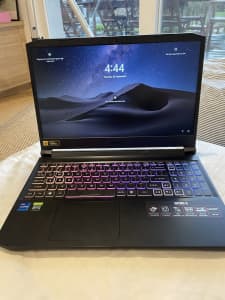 Acer Nitro 5 Gaming laptop and a mouse and keyboard