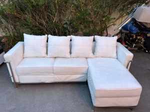 ! white leather L shape sofa with strong silver frame