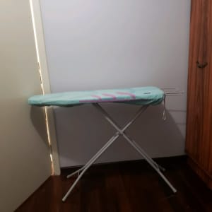 Ironing board with padded Velcro cover