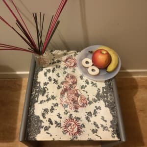Small decoupaged table with Hindu symbol AUM, perfect for a pray table