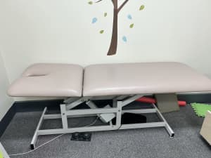 Two electronic medical treatment beds/plinths