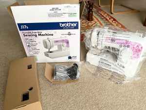 BROTHER J17s PORTABLE FREE ARM SEWING MACHINE (NEW), UNUSED.