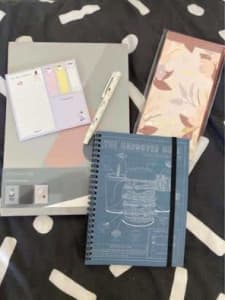 5 notebooks, sticky notes and pen