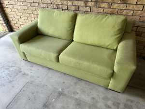Green freedom two seater couch