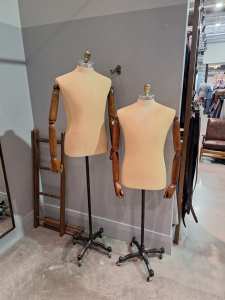 Two mannequins with adjustable height on wheels