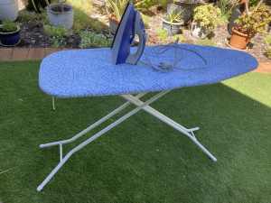 Steam Iron & ironing board with coat hangers.