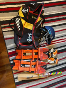 Junior cricket kit with bag and helmet