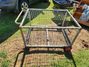 Nice steel cage on wheels for storage or moving stuff around 