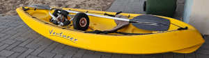 Yellow Venturer kayak with paddle, back rest and trolley
