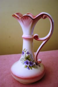 Fine Porcelain Vase featuring gilded exterior & floral emblem