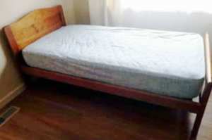 wooden single bed frame with mattress