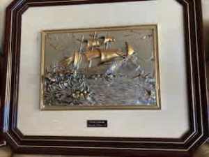 Silver and gold framed sculptures.
