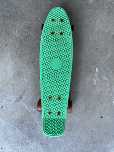Green and orange childs penny board
